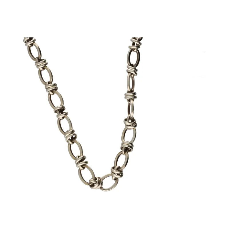 Silver chain necklace on a white background