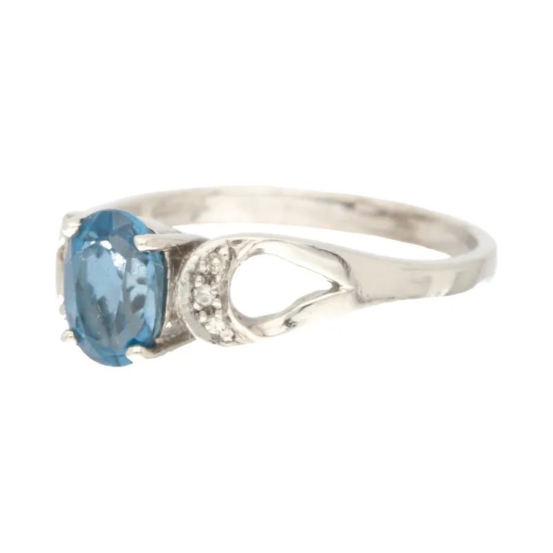Opulent Pre - Owned 9ct White Gold Oval London Blue Topaz & Diamond Ring2026W36-8-41