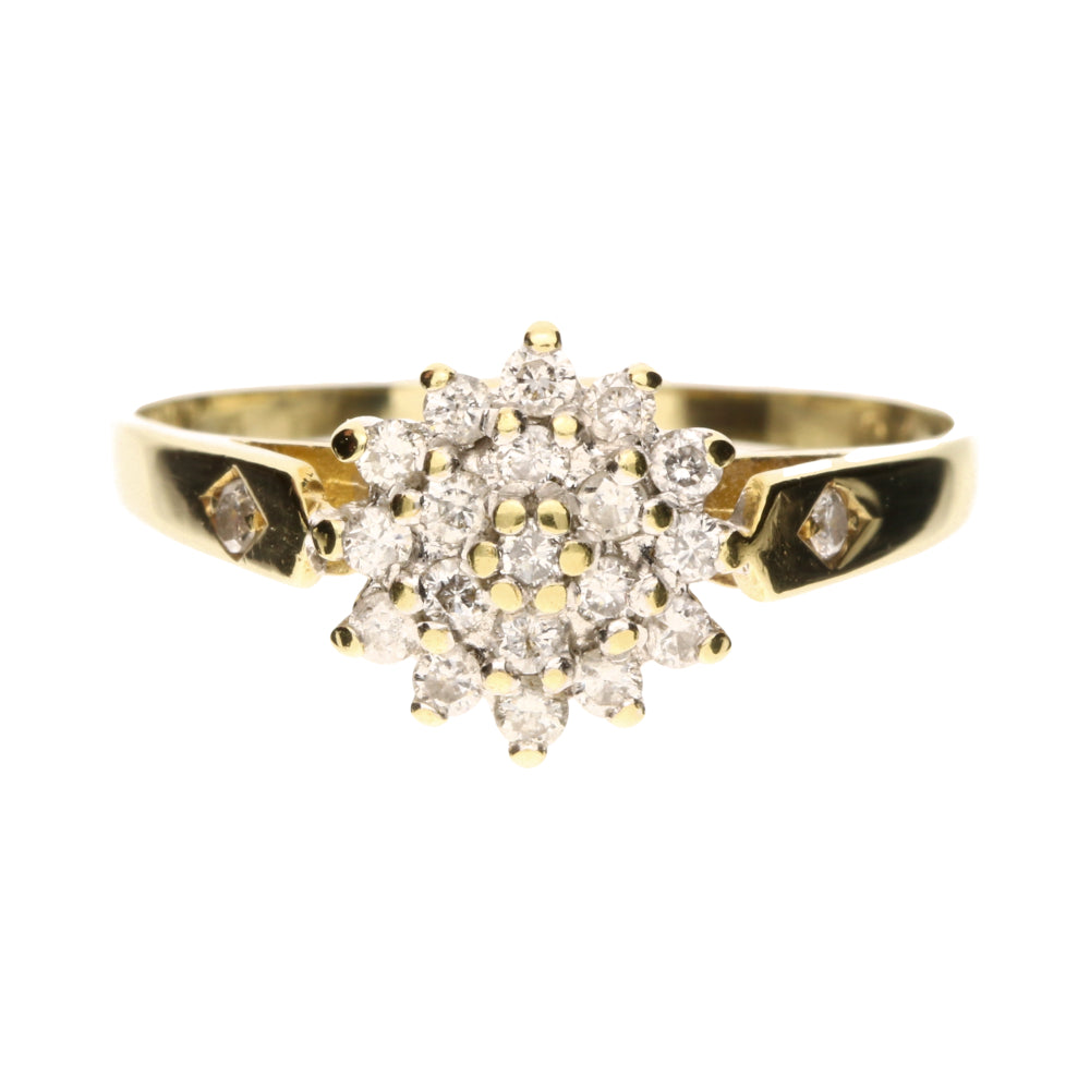 pre-owned gold ring with diamond cluster and single diamonds on shoulder