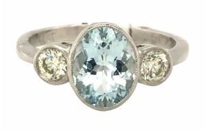 Aquamarine diamond three stone platinum ring